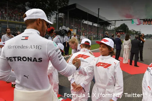 Lewis Hamilton shaking hands with 12-year-old Andrea Kimi Antonelli on the grid ahead of the 2018 Italian Grand Prix at Monza Circuit.&nbsp;