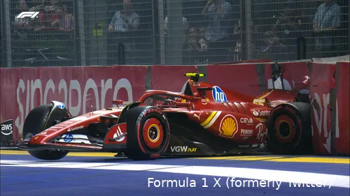 Ferrari car driven by Carlos Sainz crashes into the Tecpro barrier near the main straight, with severe damage to the rear. Fans are visible in the background, watching the aftermath.