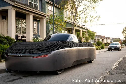 Alef - a real flying car model parked near a house