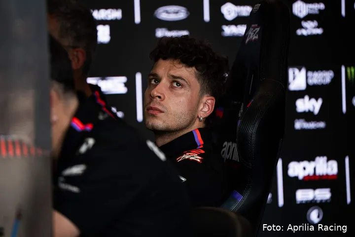 Marco Bezzecchi sitting in the Aprilia MotoGP box in Brno