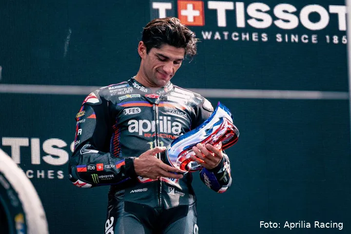 Jorge Martin Aprilia MotoGP rider looks at the 3rd place trophy at Assen