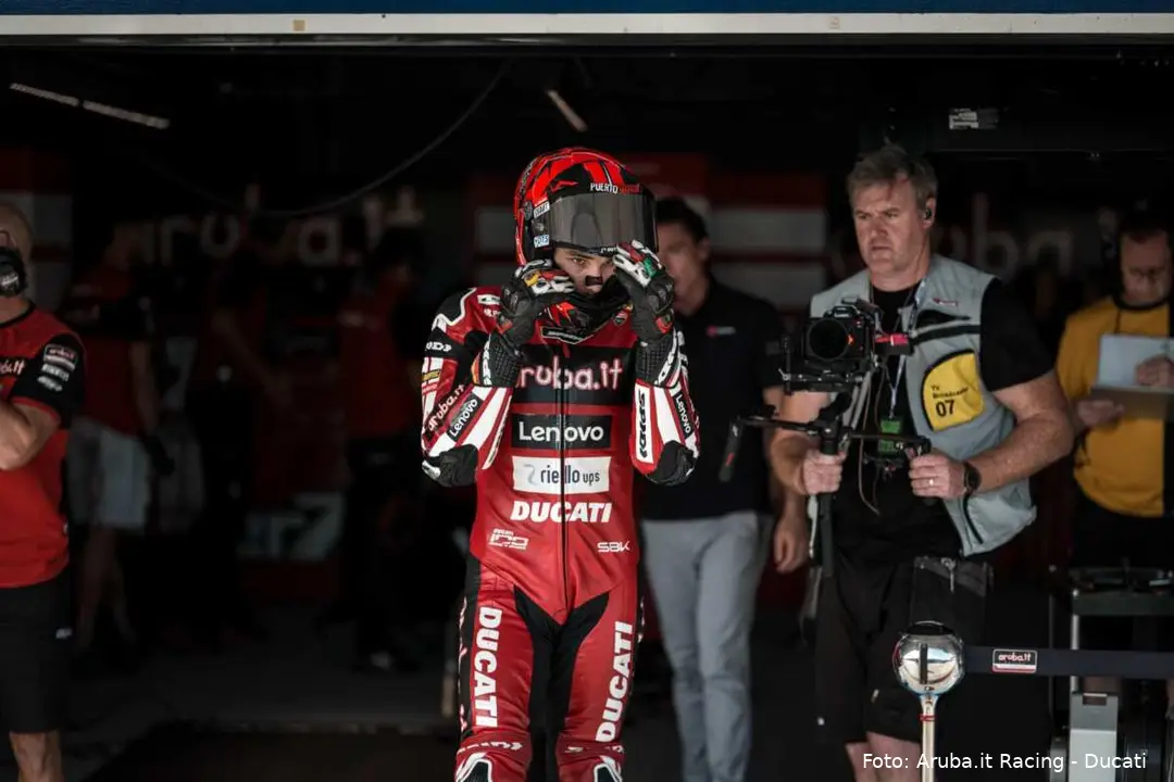 Iker Lecuona leaving the Aruba Ducati SBK garage in his leathers and helmet