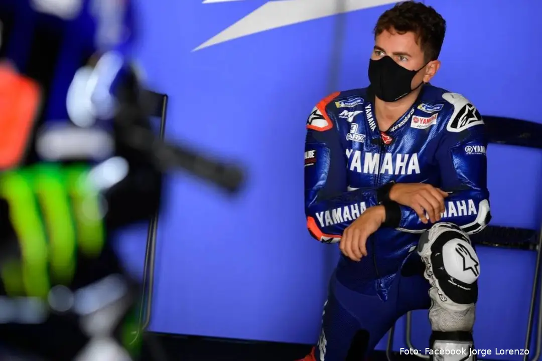 Jorge Lorenzo Yamaha MotoGP test rider kneeling in the garage