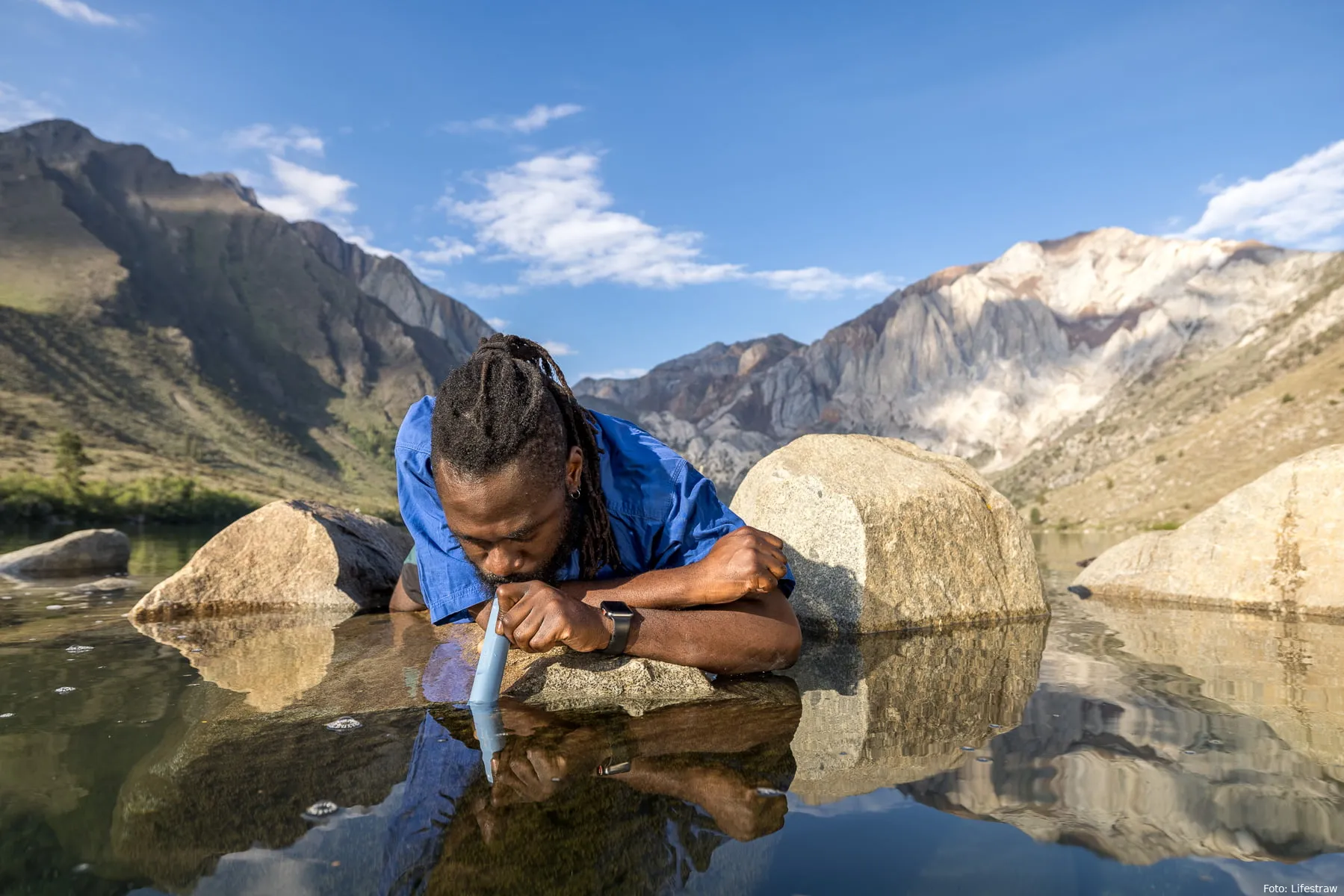 lifestraw peak personal mountain blue lifestyle drinking hiker front adam barker 02