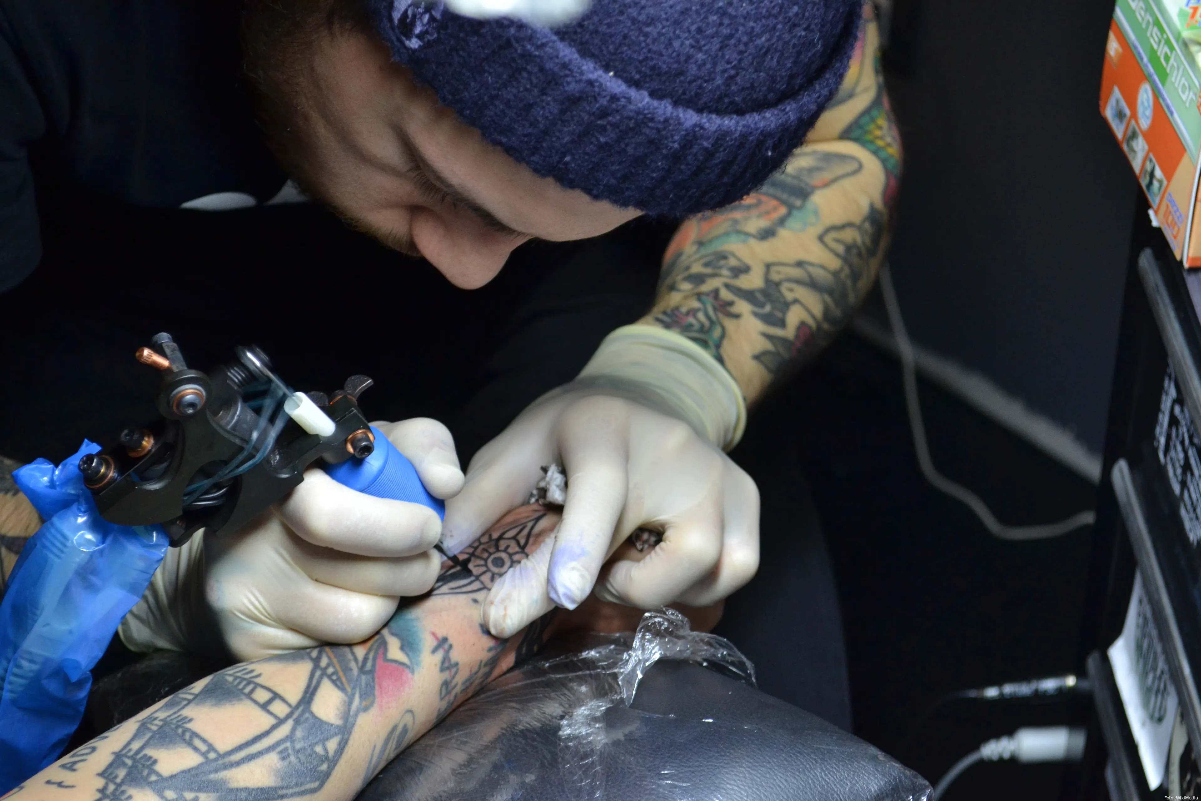 italian tattoo artist at work