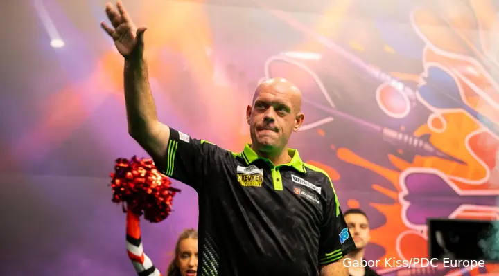 Michael van Gerwen waves to the crowd.