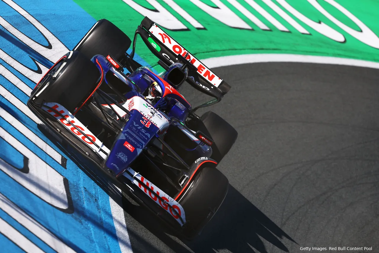 Close-up of Daniel Ricciardo maneuvering his car through the banked Turn 3 at Circuit Zandvoort during the 2024 Dutch Grand Prix race weekend.