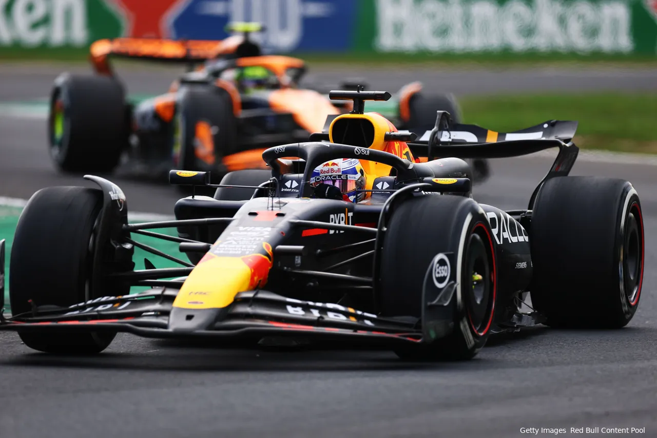 Max Verstappen coming out of the 'Della Roggia' chicane at Monza Circuit, followed by Lando Norris in a McLaren during the 2024 Italian Grand Prix.