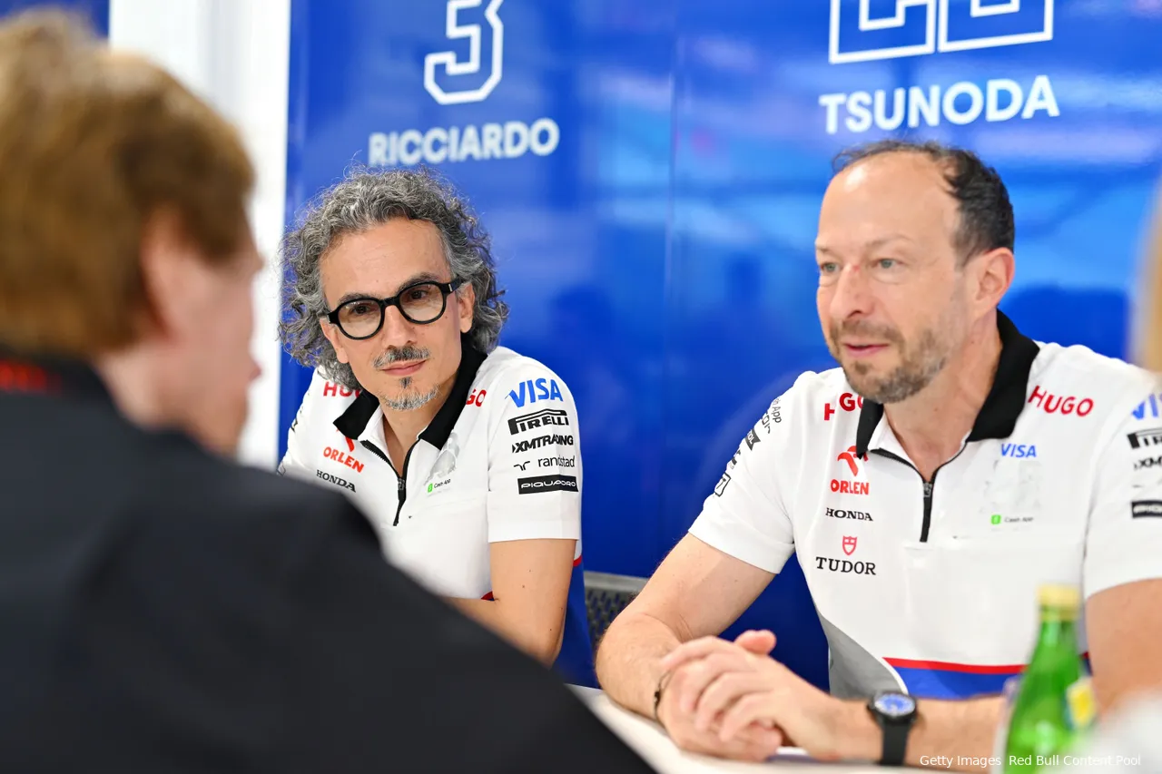 Racing Bulls F1 team principal Laurent Mekies and CEO Peter Bayer talking to&amp;nbsp;Jerry Bruckheimer ahead of the 2024 Miami Grand Prix.