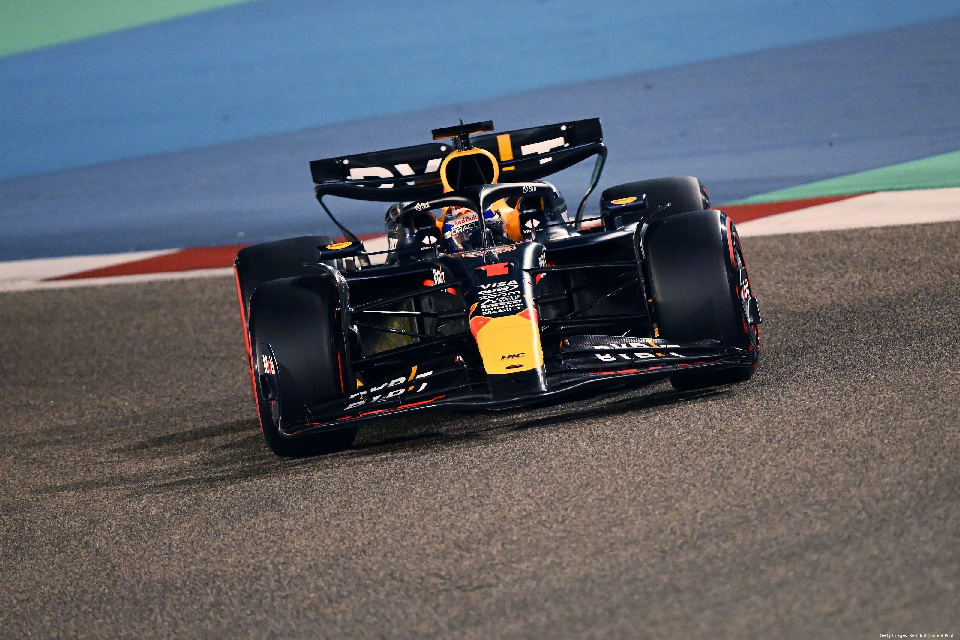 Max Verstappen is turning his RB20 into one of the corners at Bahrain International Circuit