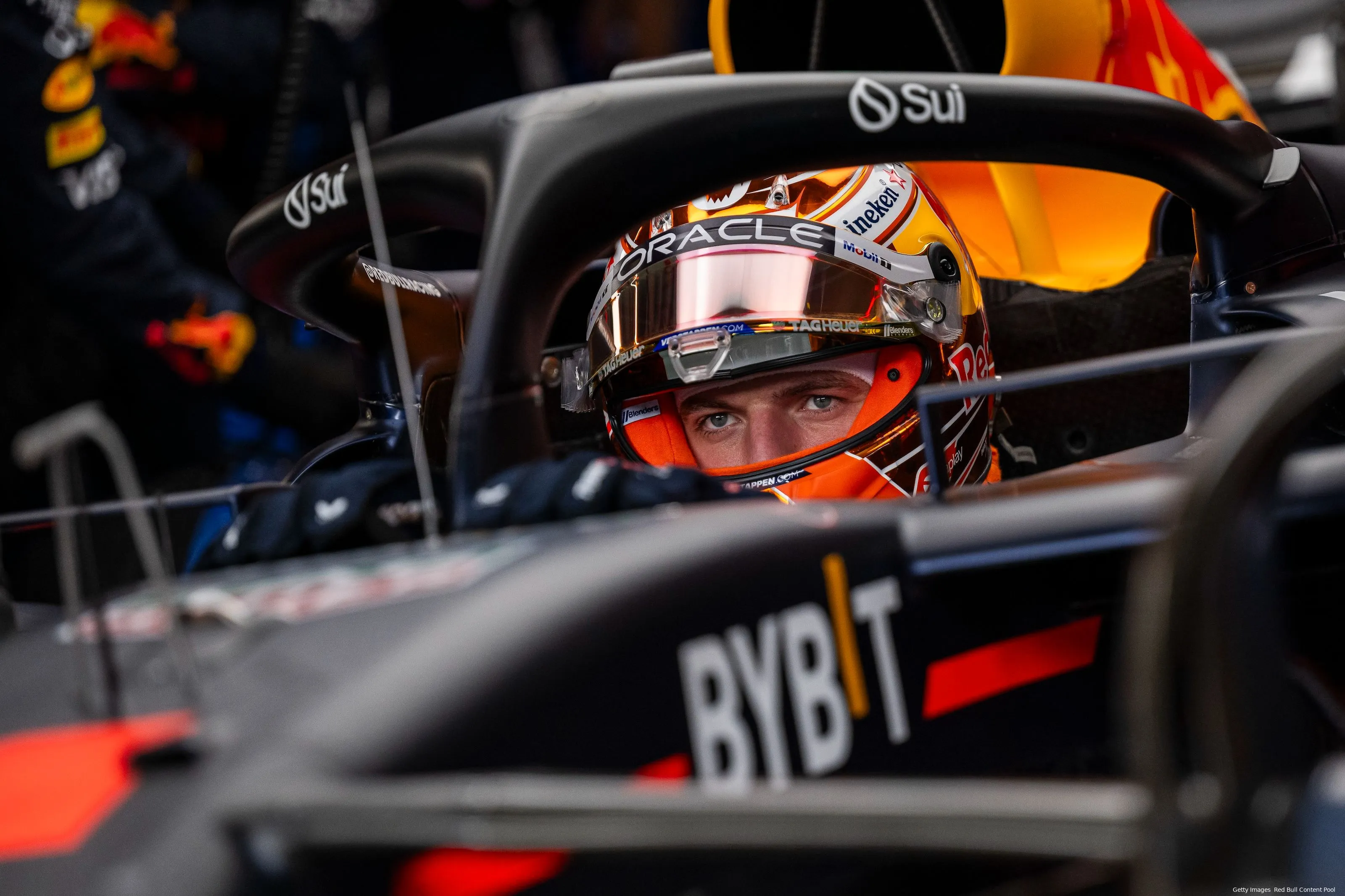 Close-up of Max Verstappen sitting in his car, fully focused, getting himself ready to go out on track