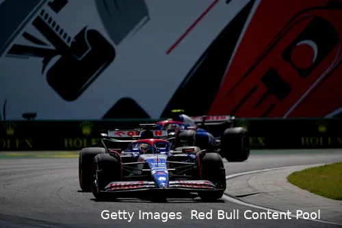 Daniel Ricciardo closely followed by Yuki Tsunoda in the technical section of Hungaroring during the 2024 Hungarian Grand Prix.