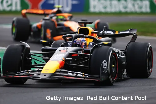 Max Verstappen coming out of the 'Della Roggia' chicane at Monza Circuit, followed by Lando Norris in a McLaren during the 2024 Italian Grand Prix.
