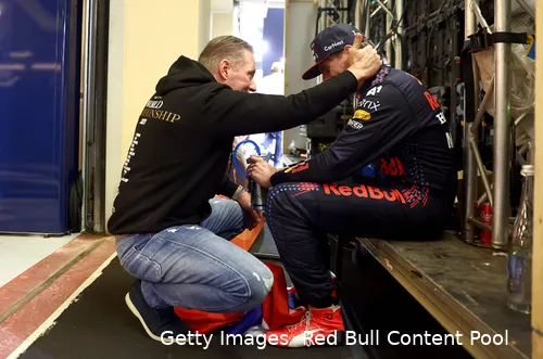 Jos Verstappen and Max Verstappen sharing an emotional moment backstage after winning the 2021 F1 Championship in Abu Dhabi.