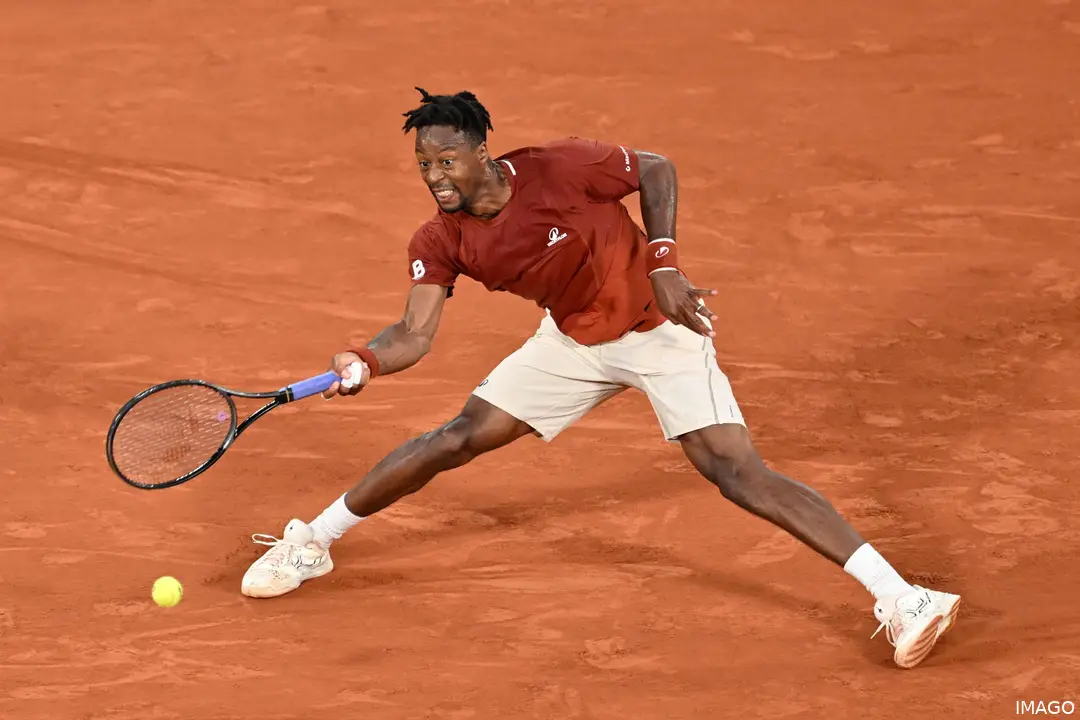 Gael Monfils sliding to hit the ball at Roland Garros 2025