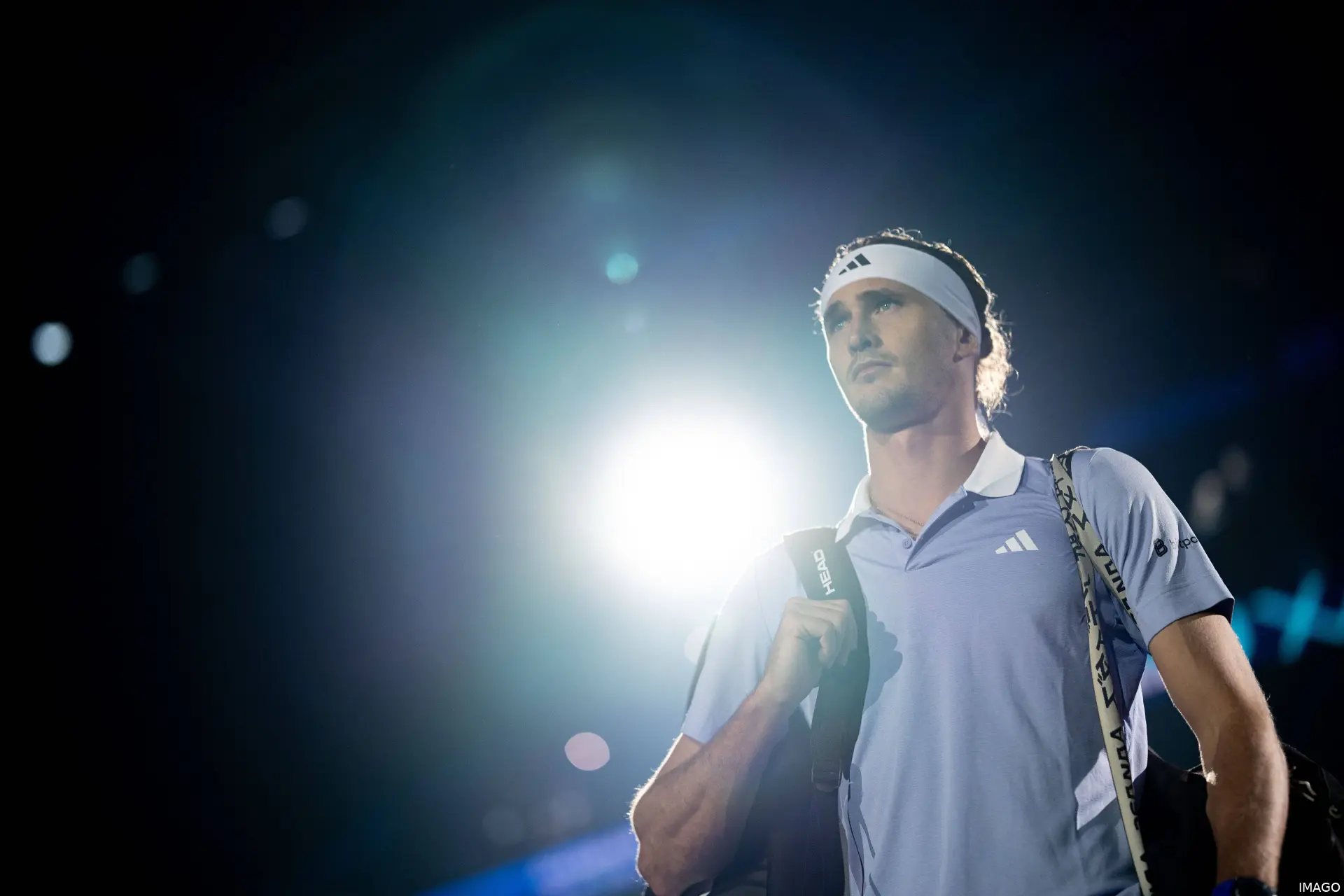 Sascha Zverev looks on.