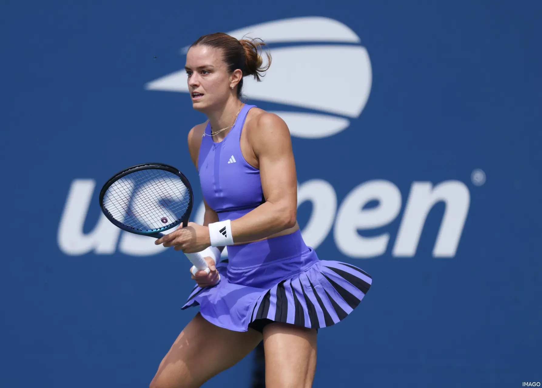 Maria Sakkari holds racquet in her hand.