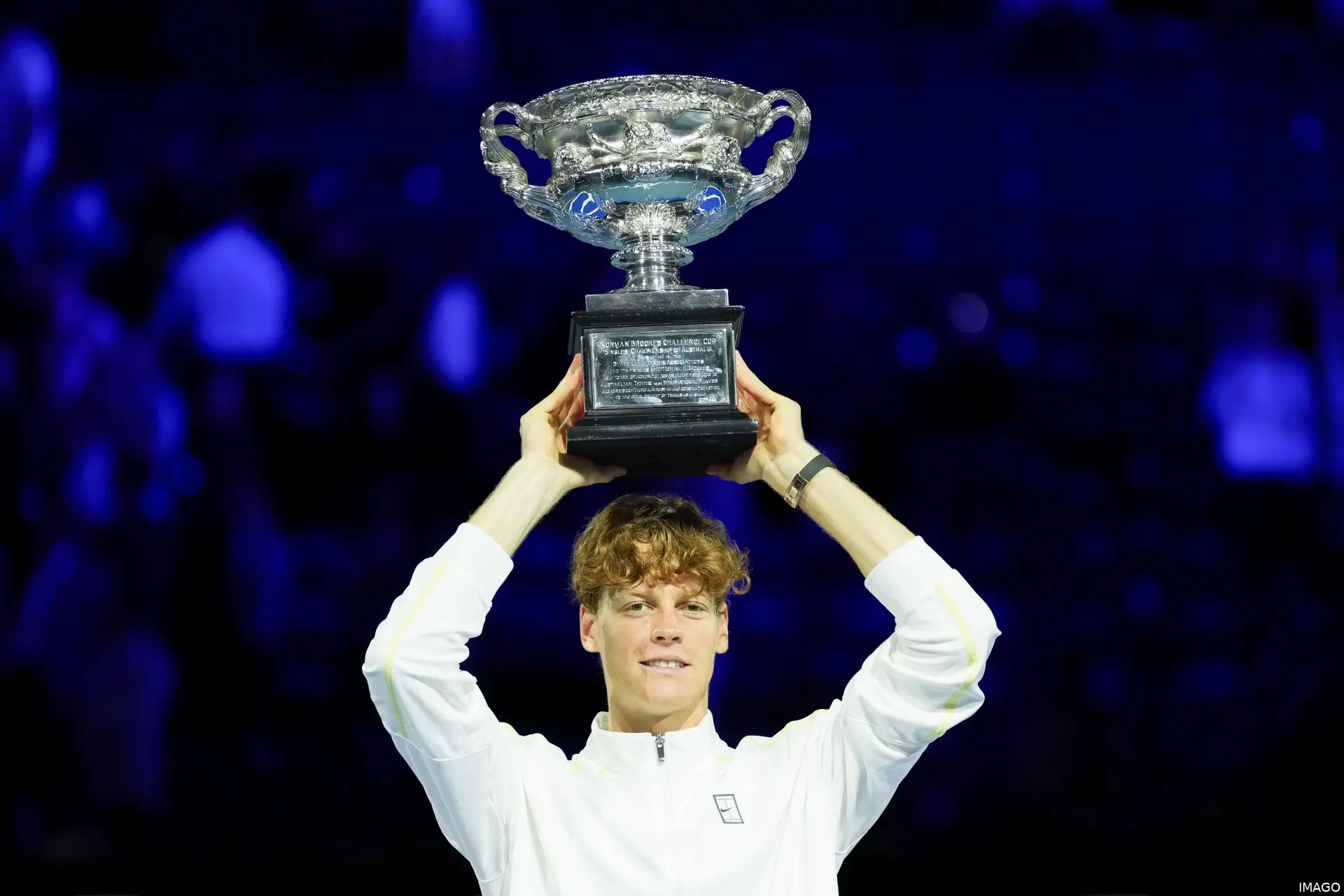 Jannik Sinner holding the Cup on his head after winning the Australian Open 2026