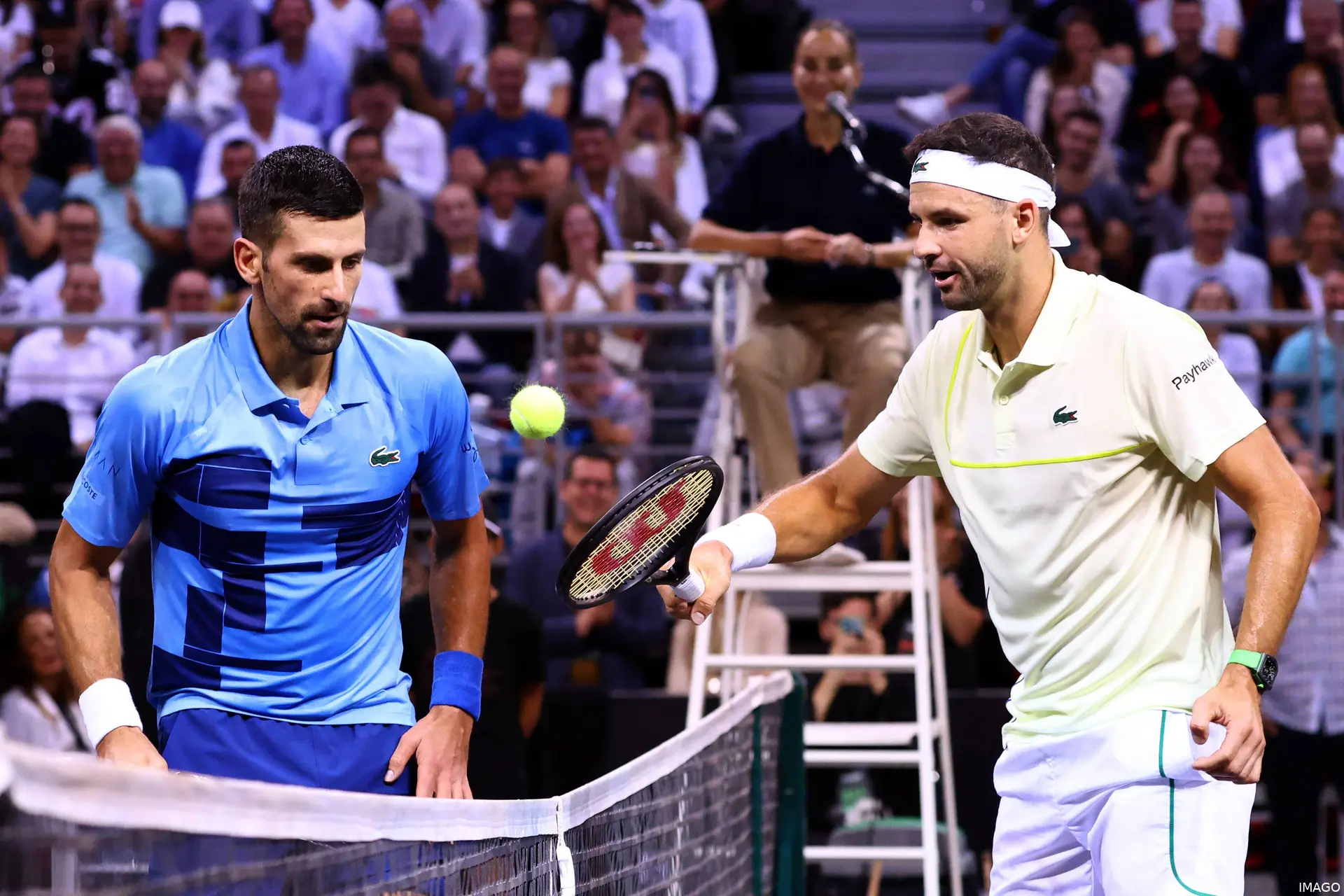 Novak Djokovic shakes hands with Grigor Dimitrov.