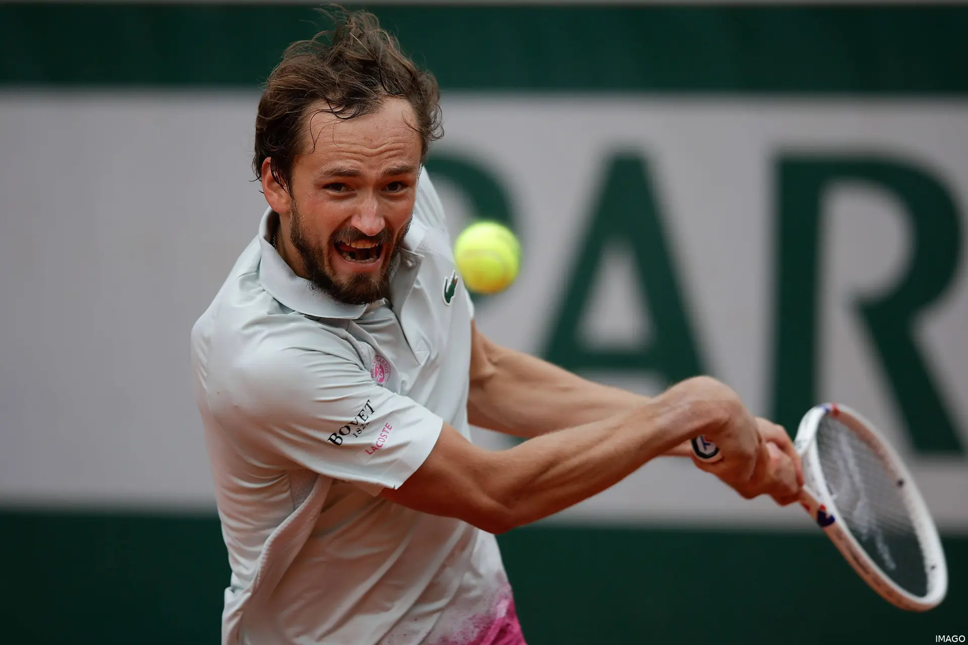 Medvedev hits the ball.