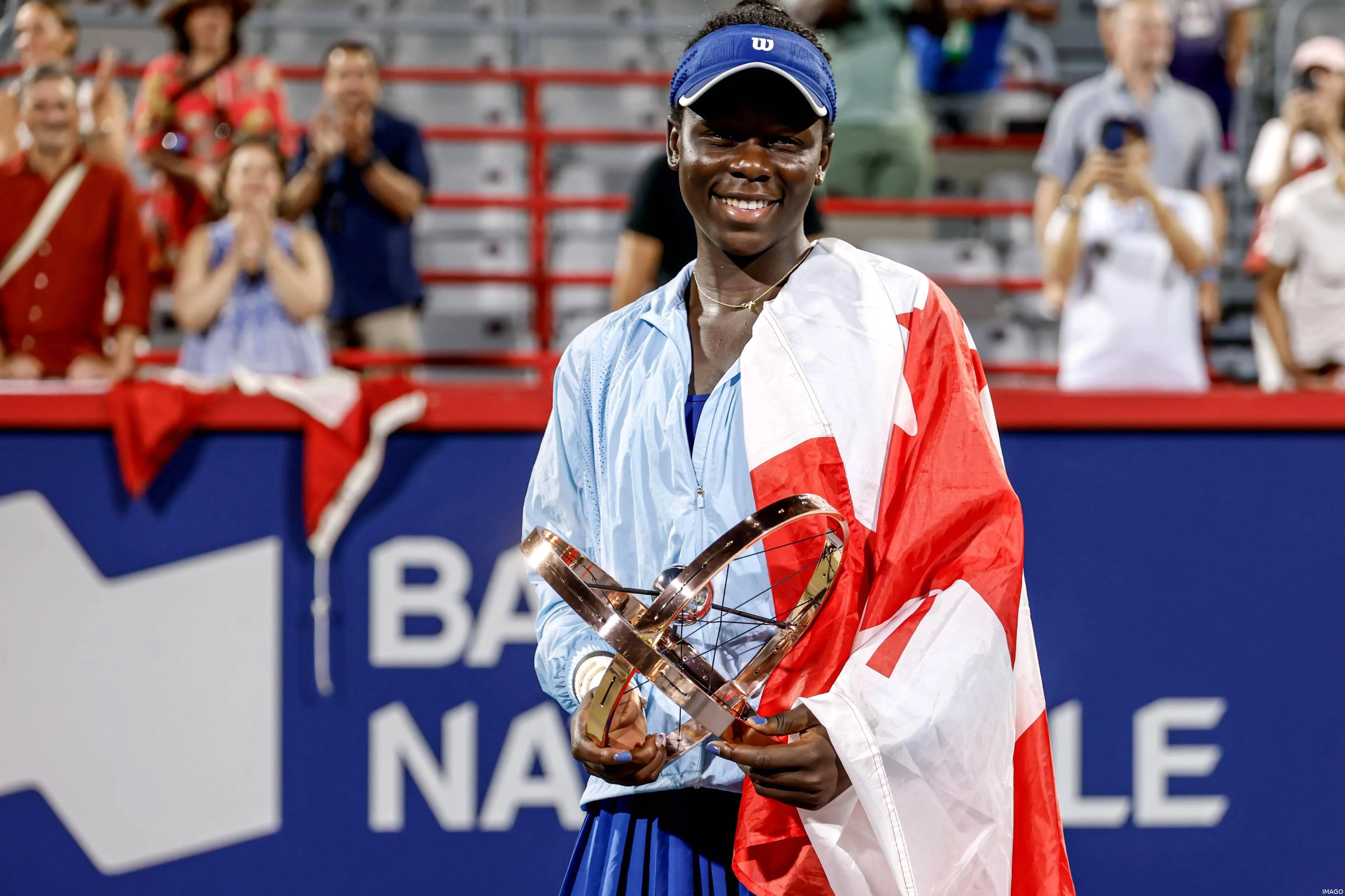 Victoria Mboko posing for the camera after winning the 2025 Canadian Open