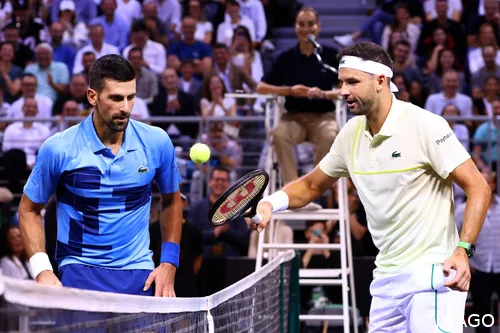 Novak Djokovic shakes hands with Grigor Dimitrov.