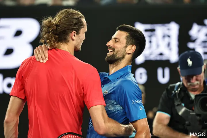 Djokovic and Zverev hug.