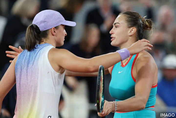 Aryna Sabalenka and Iga Swiatek at the net after facing off at 2025 Roland Garros