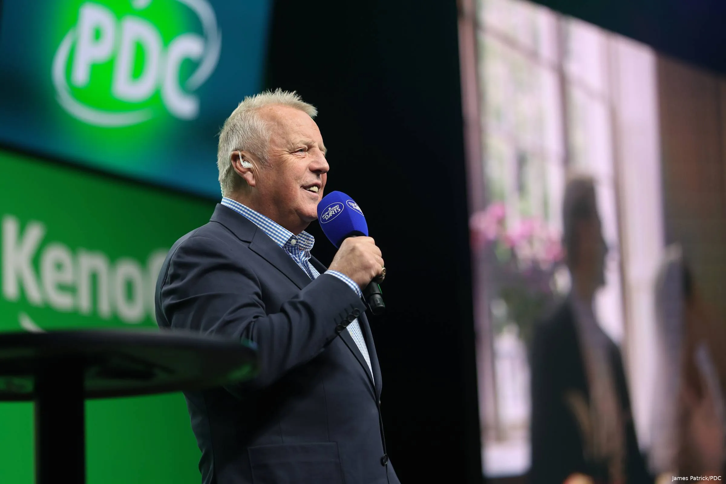 John McDonald holds the mic ready to call on the players.