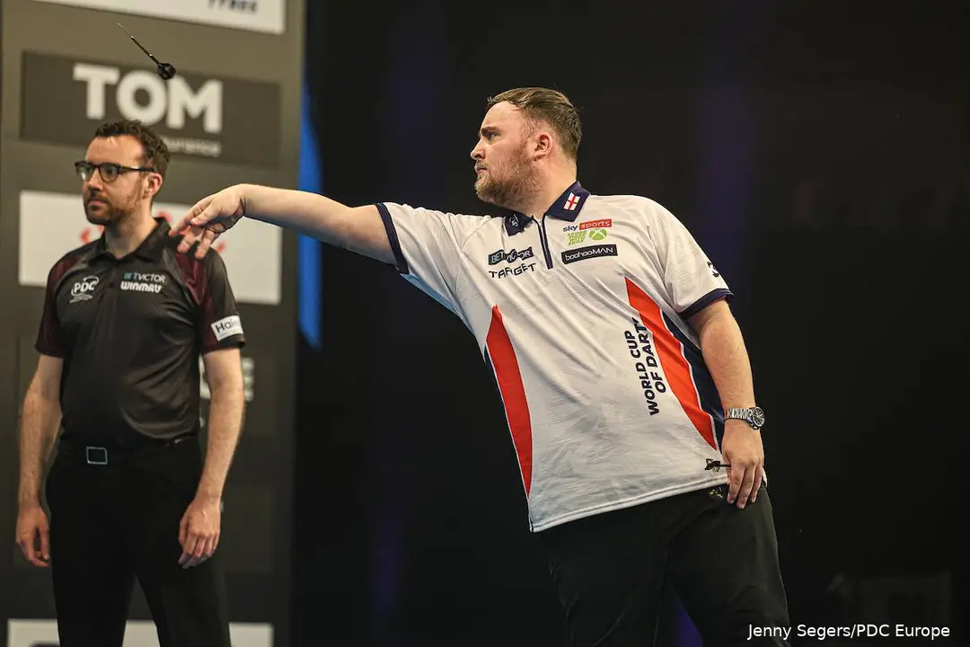 Luke Littler throws a dart
