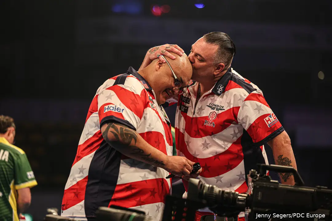 Buntz plants a kiss on Sevada’s head.