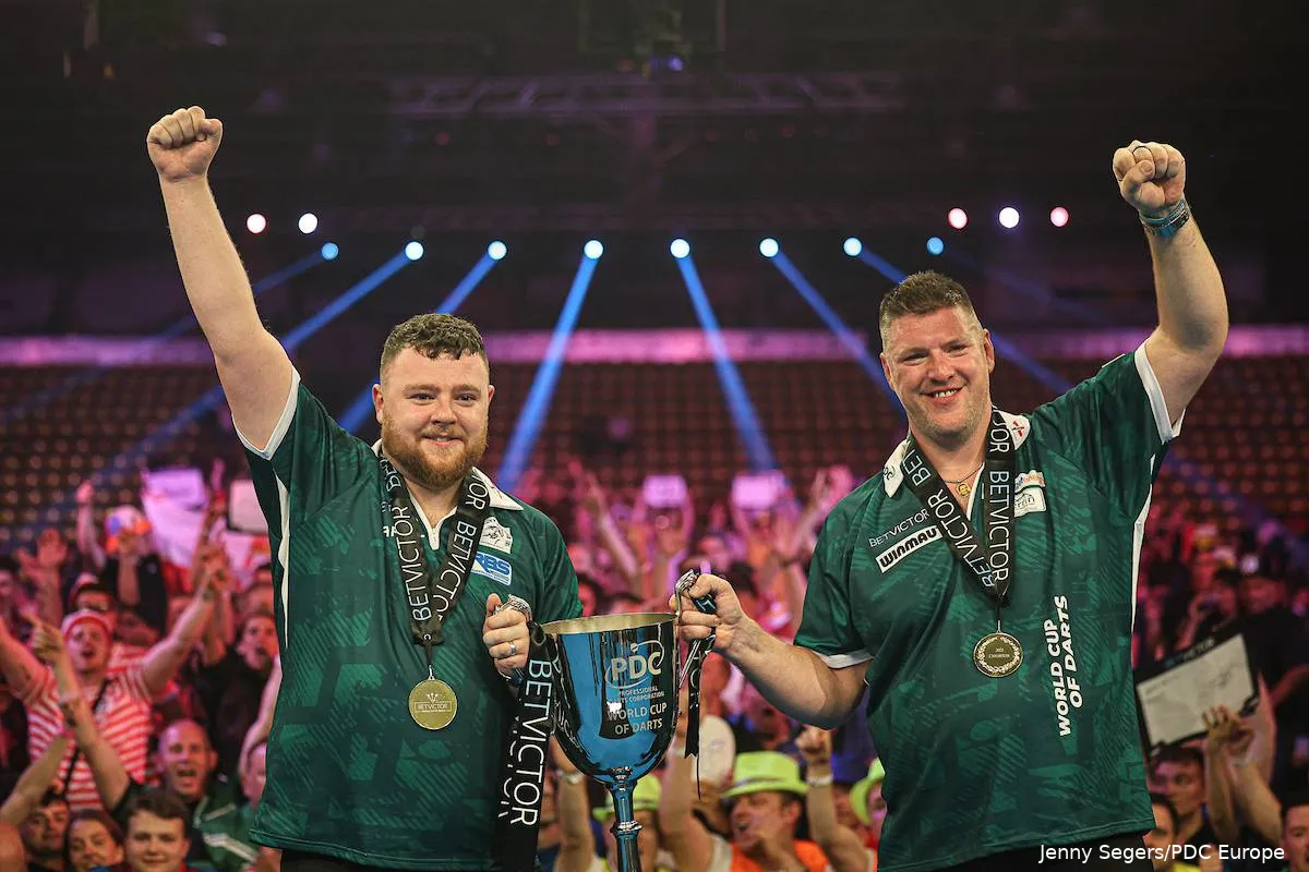 Josh Rock and Daryl Gurney show off their trophy at the 2025 World Cup of Darts