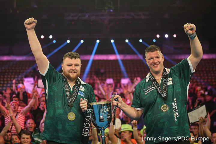 Josh Rock and Daryl Gurney showing off their trophy at the 2025 World Cup of Darts