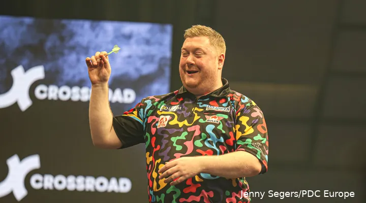 Ricky Evans throws darts.