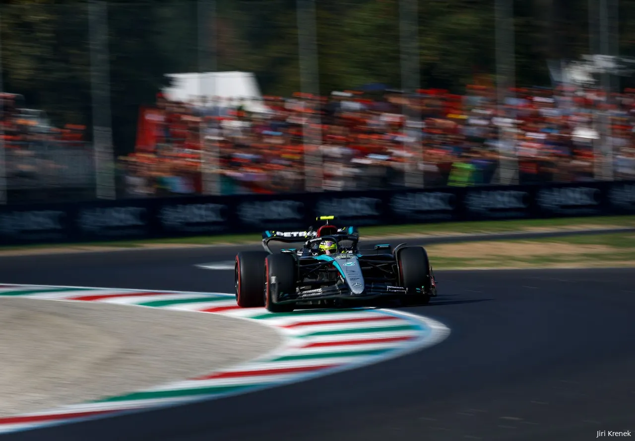 Lewis Hamilton going through Ascari Chicane during the 2024 Italian Grand Prix qualifying, with a crowd of fans seen on grandstands in the background.