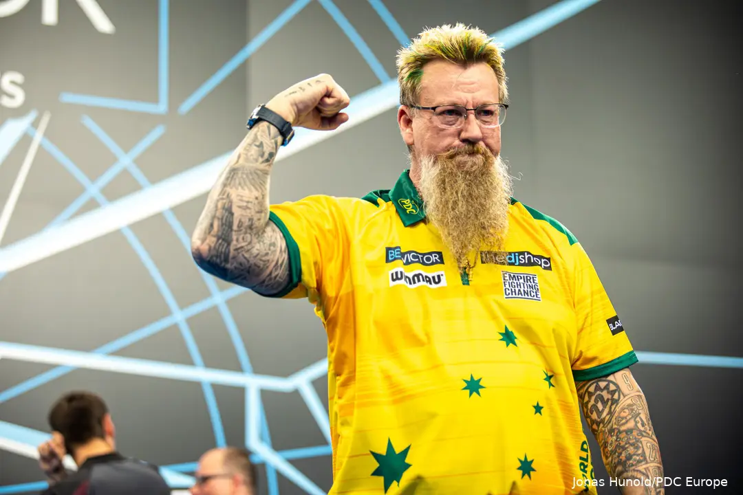 Simon Whitlock clenches his right fist toward the crowd.