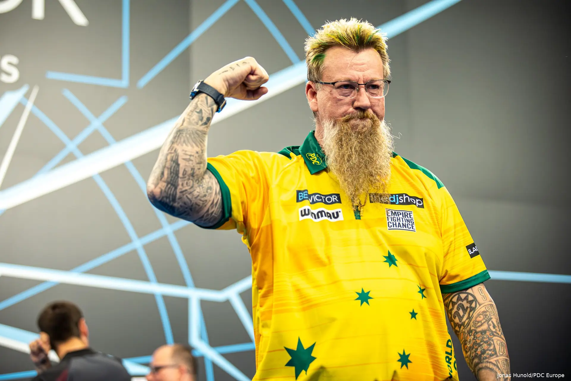 Simon Whitlock clenches his right fist toward the crowd.