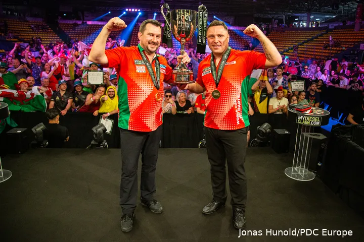 Price and Clayton posing with the trophy in 2023