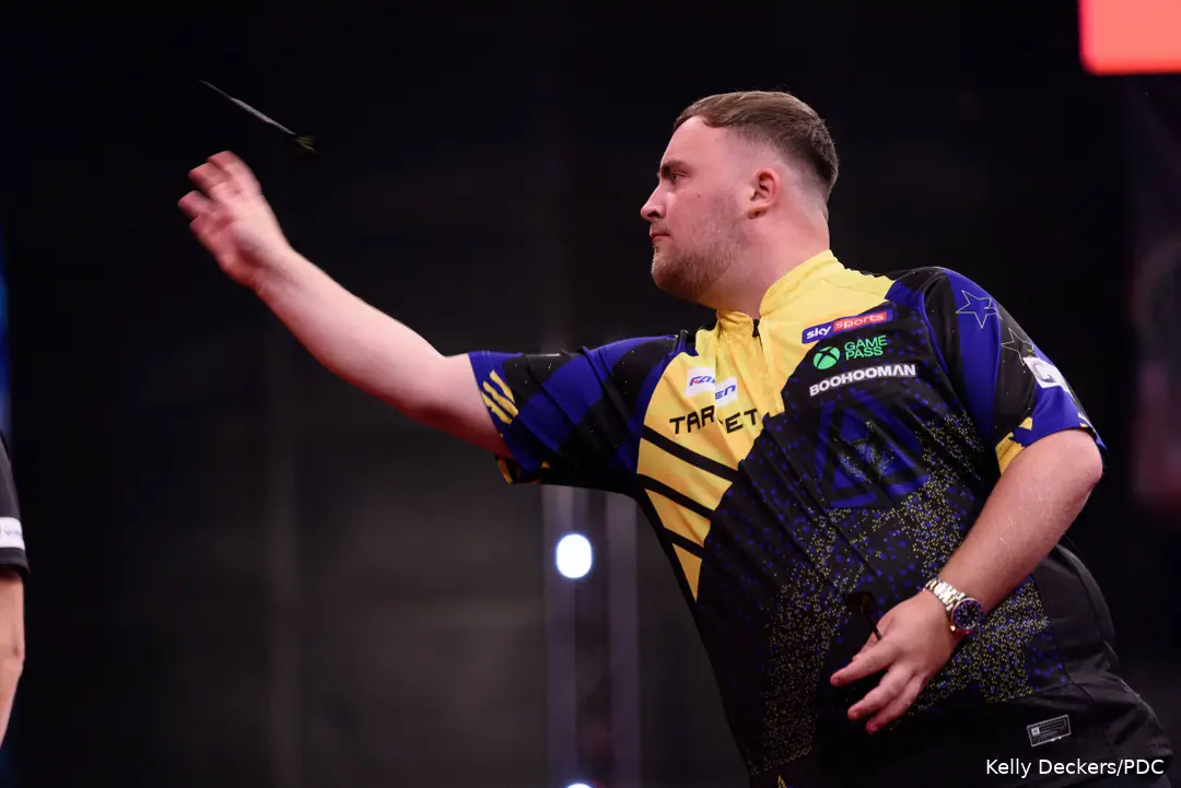 Luke Littler throws dart.