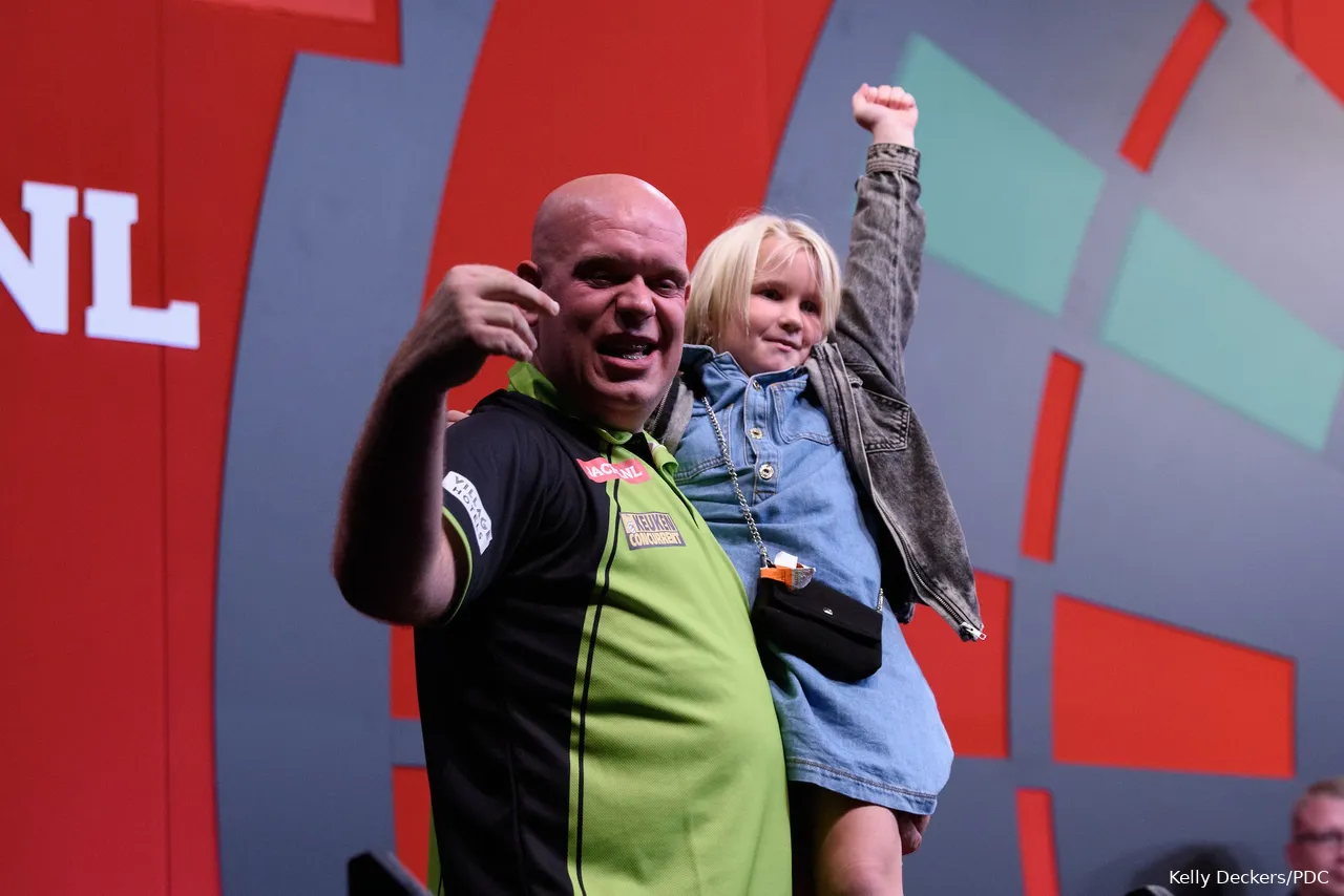 Michael van Gerwen with his baby daughter on stage during the World Series of Darts Finals