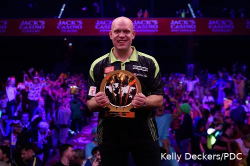 Michael van Gerwen proudly poses with World Series of Darts Finals trophy