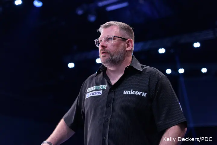James Wade walks onto stage.