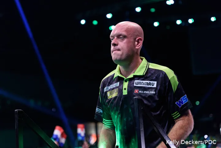 Michael van Gerwen walks up stage.