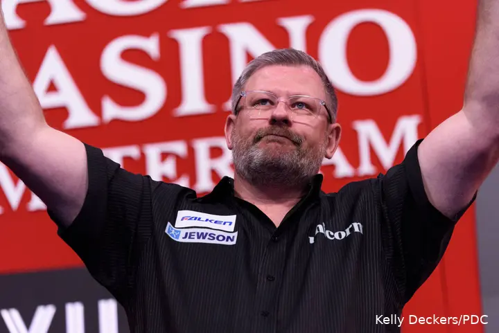 James Wade lifts arms.