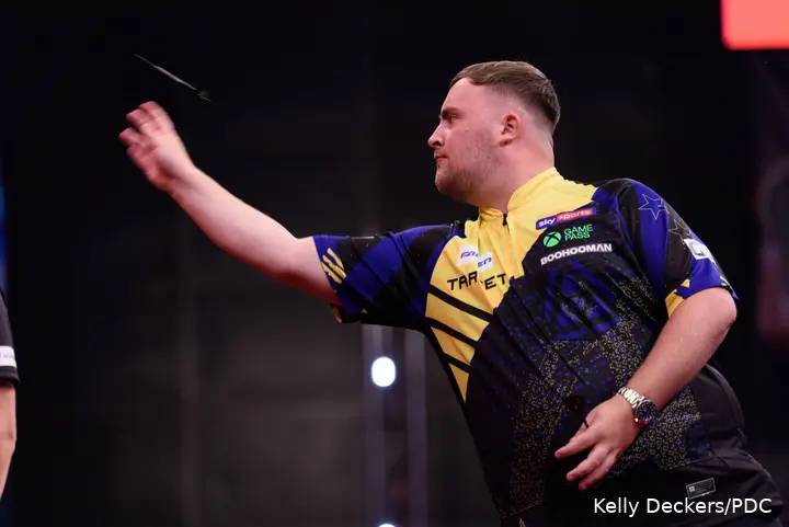 Luke Littler throws dart.