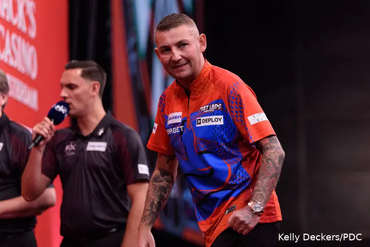 Nathan Aspinall celebrates.