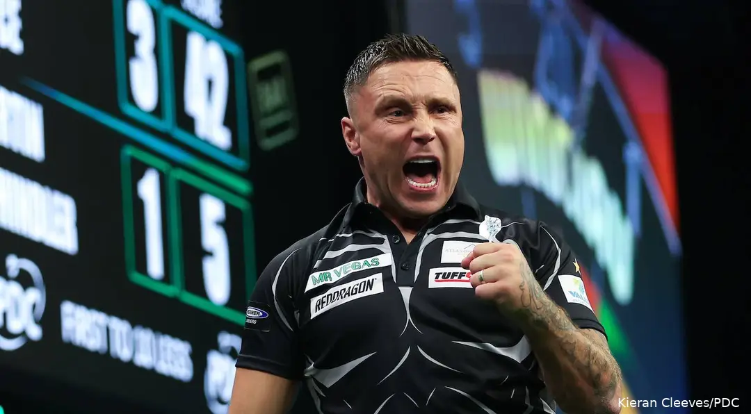 Gerwyn Price has mouth open and fist clenched letting out a roar against Martin Schindler.