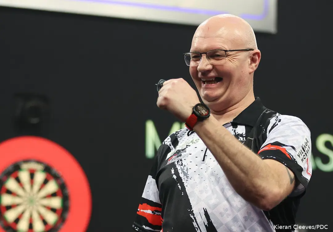 Mickey Mansell pumps his fist and smiles at the crowd.