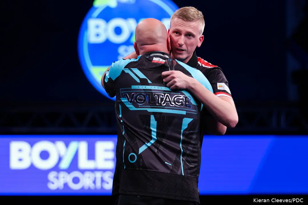 Wessel Nijman and Rob Cross embrace after their opening round match at the 2026 World Grand Prix