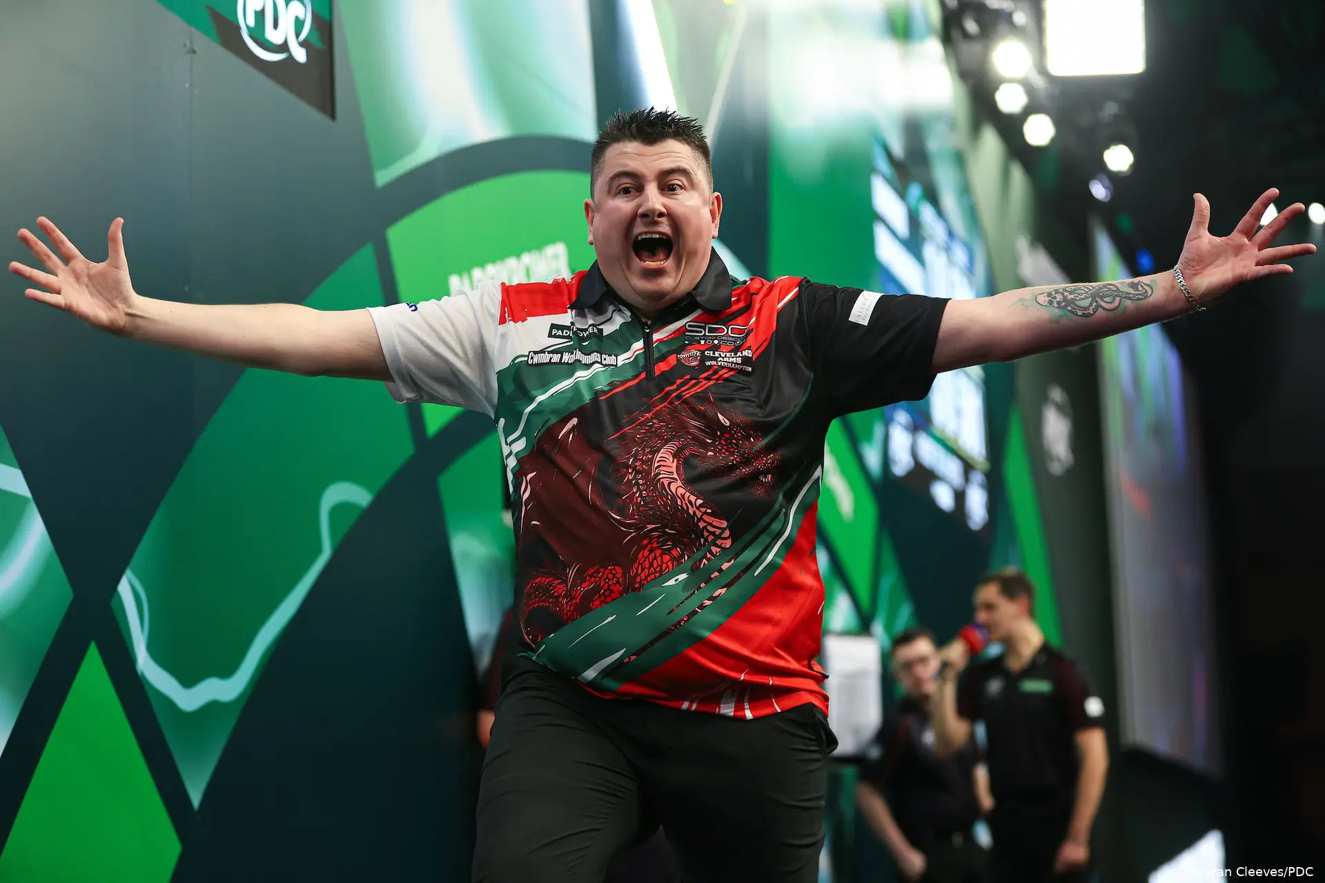 Nick Kenny has arms out celebrating at PDC World Darts Championship.